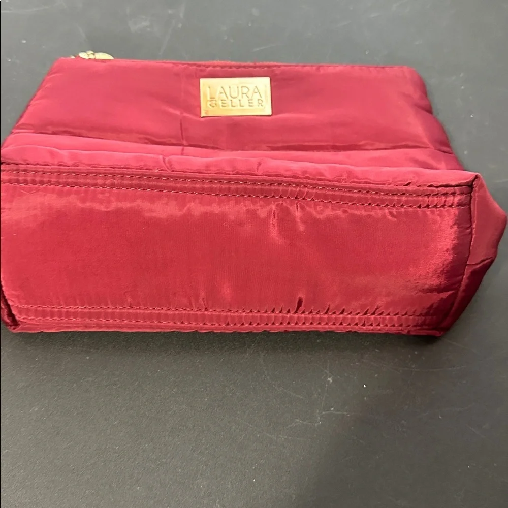 Laura Geller maroon cosmetic bag